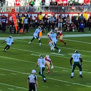 A group of people playing a game of football