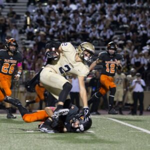 football player tackling another player in a match
